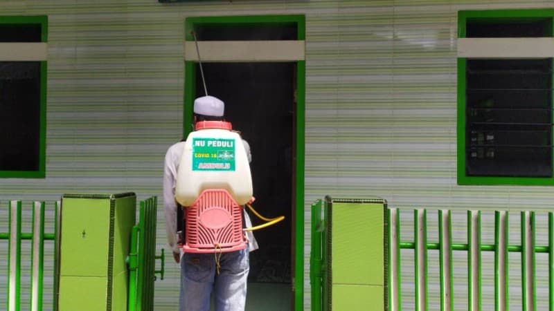 Aktivis NU Ambulu Jember Redam Penyebaran Covid-19