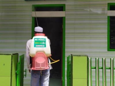 Aktivis NU Ambulu Jember Redam Penyebaran Covid-19
