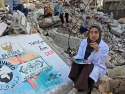 Seniman Palestina Lukis Logo LAZISNU di Puing Bangunan, Wujud Terima Kasih